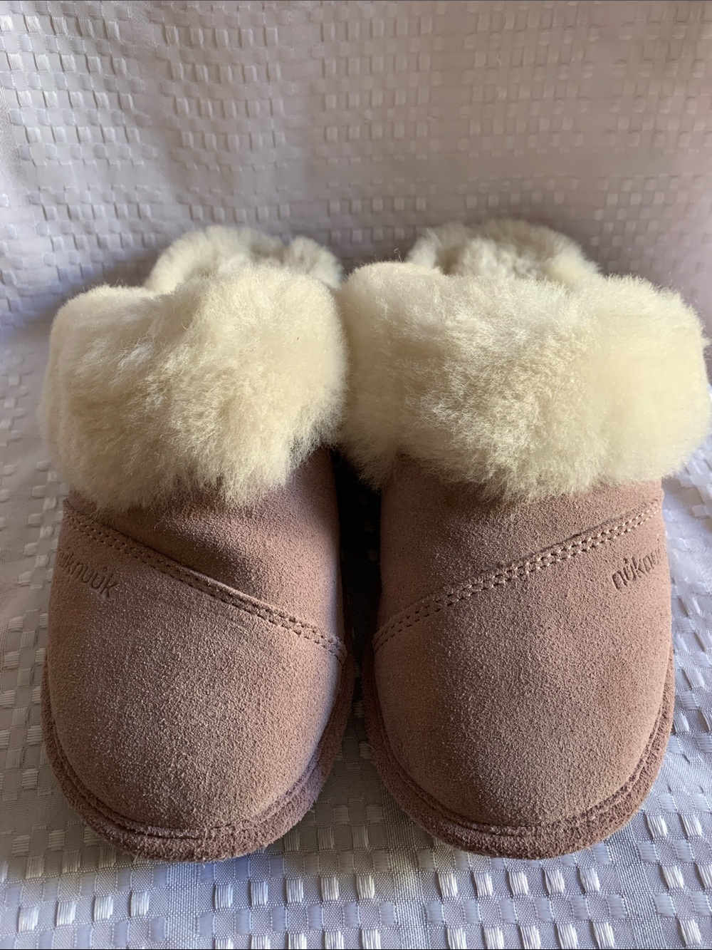Nuknuuk women’s tan suede slippers with sheepskin insole, size 7.